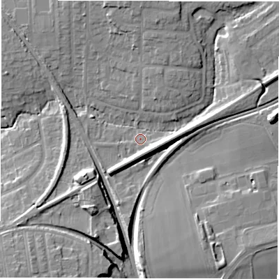 Shaded relief map of the ground around NE129JY, computed from Environment Agency LiDAR. The ground here sits at about 57 m above sea level and falls 14 m across the surrounding 800 m. Surface water reaching this point runs off ground lying to the north, 8.4 m higher.