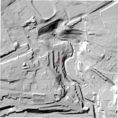 Shaded relief map of the ground around NE12PQ, computed from Environment Agency LiDAR. The ground here sits at about 12 m above sea level and falls 44 m across the surrounding 800 m. Surface water reaching this point runs off ground lying to the west, 28.3 m higher.