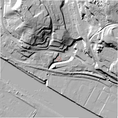 Shaded relief map of the ground around NE158LN, computed from Environment Agency LiDAR. The ground here sits at about 7 m above sea level and falls 57 m across the surrounding 800 m. Surface water reaching this point runs off ground lying to the north-north-east, 46.7 m higher.