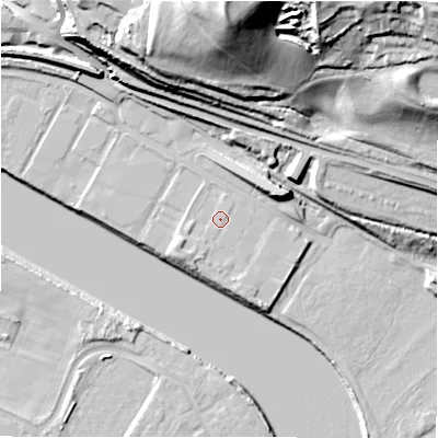 Shaded relief map of the ground around NE159RT, computed from Environment Agency LiDAR. The ground here sits at about 7 m above sea level and falls 54 m across the surrounding 800 m. Surface water reaching this point runs off ground lying to the south-west, 2.1 m higher.