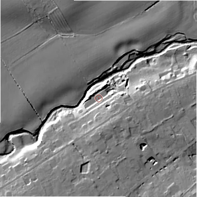 Shaded relief map of the ground around NE209AB, computed from Environment Agency LiDAR. The ground here sits at about 65 m above sea level and falls 17 m across the surrounding 800 m. Surface water reaching this point runs off ground lying to the south-south-east, 9.4 m higher.