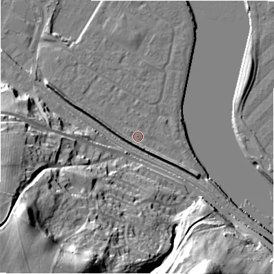 Shaded relief map of the ground around NE214FJ, computed from Environment Agency LiDAR. The ground here sits at about 5 m above sea level and falls 53 m across the surrounding 800 m. Surface water reaching this point runs off ground lying to the west-south-west, 4.5 m higher.