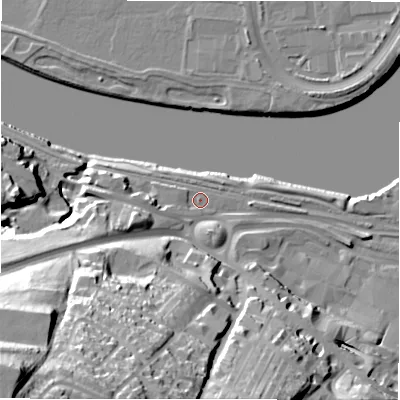 Shaded relief map of the ground around NE214JB, computed from Environment Agency LiDAR. The ground here sits at about 6 m above sea level and falls 60 m across the surrounding 800 m. Surface water reaching this point runs off ground lying to the west, 6.1 m higher.
