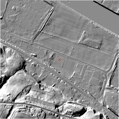 Shaded relief map of the ground around NE214NT, computed from Environment Agency LiDAR. The ground here sits at about 4 m above sea level and falls 55 m across the surrounding 800 m. Surface water reaching this point runs off ground lying to the south-west, 53.4 m higher.