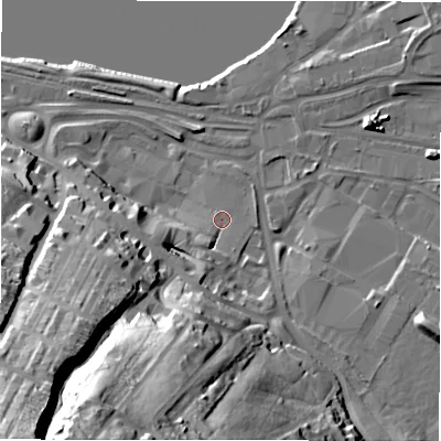Shaded relief map of the ground around NE215BT, computed from Environment Agency LiDAR. The ground here sits at about 6 m above sea level and falls 68 m across the surrounding 800 m. Surface water reaching this point runs off ground lying to the south-south-west, 5.6 m higher.