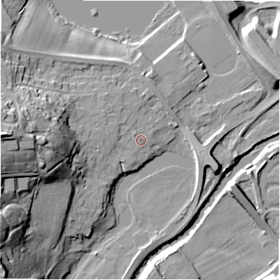 Shaded relief map of the ground around NE215PF, computed from Environment Agency LiDAR. The ground here sits at about 7 m above sea level and falls 33 m across the surrounding 800 m. Surface water reaching this point runs off ground lying to the west, 18.4 m higher.