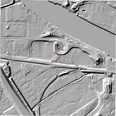 Shaded relief map of the ground around NE215TB, computed from Environment Agency LiDAR. The ground here sits at about 4 m above sea level and falls 12 m across the surrounding 800 m. Surface water reaching this point runs off ground lying to the north-north-west, 6.3 m higher.