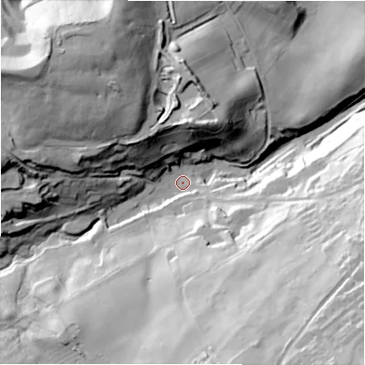 Shaded relief map of the ground around NE216JJ, computed from Environment Agency LiDAR. The ground here sits at about 69 m above sea level and falls 73 m across the surrounding 800 m. Surface water reaching this point runs off ground lying to the south-south-east, 54.7 m higher.