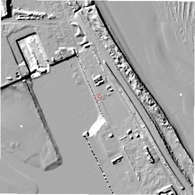 Shaded relief map of the ground around NE241AE, computed from Environment Agency LiDAR. The ground here sits at about 4 m above sea level and falls 25 m across the surrounding 800 m. Surface water reaching this point runs off ground lying to the south-east, 13.2 m higher.