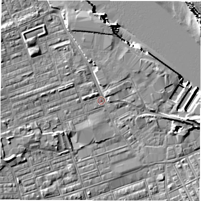 Shaded relief map of the ground around NE241LH, computed from Environment Agency LiDAR. The ground here sits at about 4 m above sea level and falls 18 m across the surrounding 800 m. Surface water reaching this point runs off ground lying to the west-south-west, 4.4 m higher.