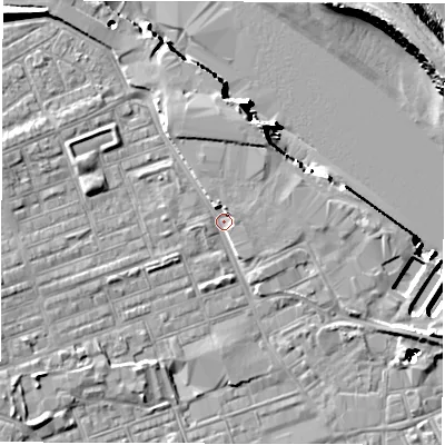 Shaded relief map of the ground around NE241LX, computed from Environment Agency LiDAR. The ground here sits at about 4 m above sea level and falls 18 m across the surrounding 800 m. Surface water reaching this point runs off ground lying to the north-west, 6.5 m higher.