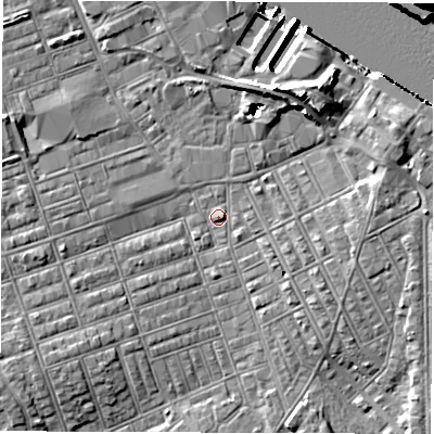 Shaded relief map of the ground around NE242DX, computed from Environment Agency LiDAR. The ground here sits at about 4 m above sea level and falls 15 m across the surrounding 800 m. Surface water reaching this point runs off ground lying to the north-east, 6.2 m higher.