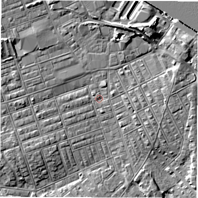 Shaded relief map of the ground around NE242JJ, computed from Environment Agency LiDAR. The ground here sits at about 3 m above sea level and falls 14 m across the surrounding 800 m. Surface water reaching this point runs off ground lying to the south-west, 3.3 m higher.