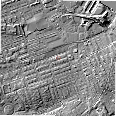 Shaded relief map of the ground around NE242JW, computed from Environment Agency LiDAR. The ground here sits at about 4 m above sea level and falls 14 m across the surrounding 800 m. Surface water reaching this point runs off ground lying to the north-east, 6.3 m higher.