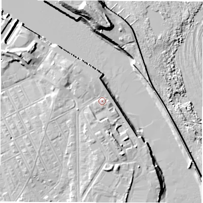 Shaded relief map of the ground around NE243AF, computed from Environment Agency LiDAR. The ground here sits at about 5 m above sea level and falls 19 m across the surrounding 800 m. Surface water reaching this point runs off ground lying to the west-south-west, 2.4 m higher.