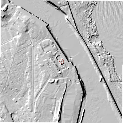 Shaded relief map of the ground around NE243BW, computed from Environment Agency LiDAR. The ground here sits at about 5 m above sea level and falls 12 m across the surrounding 800 m. Surface water reaching this point runs off ground lying to the south, 4.9 m higher.