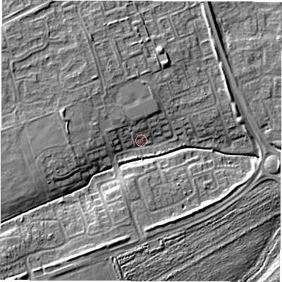 Shaded relief map of the ground around NE243PU, computed from Environment Agency LiDAR. The ground here sits at about 6 m above sea level and falls 9 m across the surrounding 800 m. Surface water reaching this point runs off ground lying to the west, 5.0 m higher.