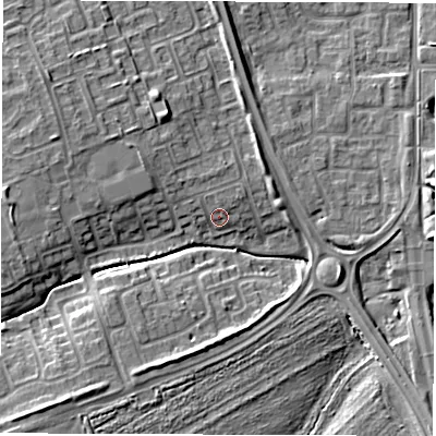 Shaded relief map of the ground around NE243PY, computed from Environment Agency LiDAR. The ground here sits at about 6 m above sea level and falls 9 m across the surrounding 800 m. Surface water reaching this point runs off ground lying to the north-north-west, 1.9 m higher.