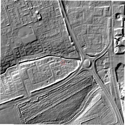 Shaded relief map of the ground around NE243QA, computed from Environment Agency LiDAR. The ground here sits at about 5 m above sea level and falls 9 m across the surrounding 800 m. Surface water reaching this point runs off ground lying to the south-south-west, 6.2 m higher.