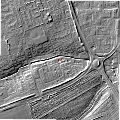 Shaded relief map of the ground around NE243QB, computed from Environment Agency LiDAR. The ground here sits at about 6 m above sea level and falls 9 m across the surrounding 800 m. Surface water reaching this point runs off ground lying to the south-south-west, 4.4 m higher.