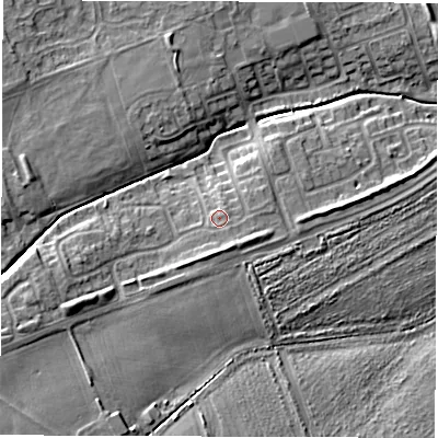 Shaded relief map of the ground around NE243QH, computed from Environment Agency LiDAR. The ground here sits at about 10 m above sea level and falls 9 m across the surrounding 800 m. Surface water reaching this point runs off ground lying to the south-south-east, 0.9 m higher.