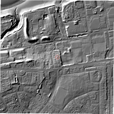 Shaded relief map of the ground around NE245HX, computed from Environment Agency LiDAR. The ground here sits at about 7 m above sea level and falls 15 m across the surrounding 800 m. Surface water reaching this point runs off ground lying to the south, 2.6 m higher.