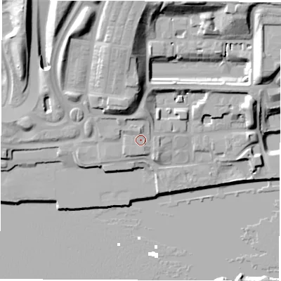 Shaded relief map of the ground around NE280QD, computed from Environment Agency LiDAR. The ground here sits at about 9 m above sea level and falls 27 m across the surrounding 800 m. Surface water reaching this point runs off ground lying to the north, 2.2 m higher.