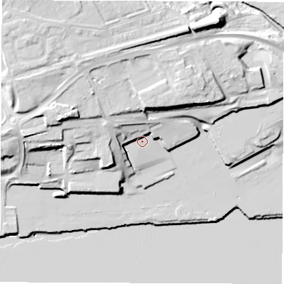 Shaded relief map of the ground around NE286HL, computed from Environment Agency LiDAR. The ground here sits at about 9 m above sea level and falls 32 m across the surrounding 800 m. Surface water reaching this point runs off ground lying to the west-north-west, 11.2 m higher.