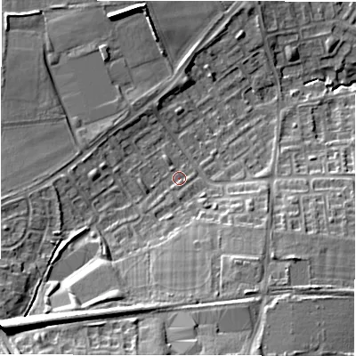 Shaded relief map of the ground around NE32UG, computed from Environment Agency LiDAR. The ground here sits at about 63 m above sea level and falls 20 m across the surrounding 800 m. Surface water reaching this point runs off ground lying to the south-west, 14.8 m higher.