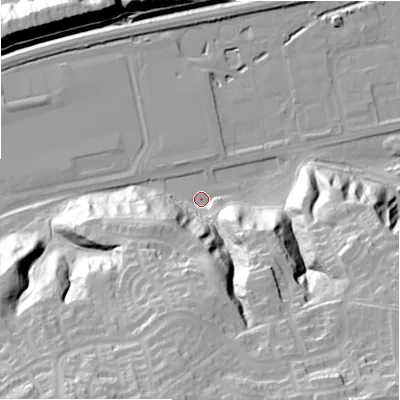Shaded relief map of the ground around NE426PL, computed from Environment Agency LiDAR. The ground here sits at about 13 m above sea level and falls 58 m across the surrounding 800 m. Surface water reaching this point runs off ground lying to the south-east, 56.3 m higher.