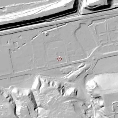 Shaded relief map of the ground around NE426QG, computed from Environment Agency LiDAR. The ground here sits at about 12 m above sea level and falls 50 m across the surrounding 800 m. Surface water reaching this point runs off ground lying to the south-east, 1.5 m higher.