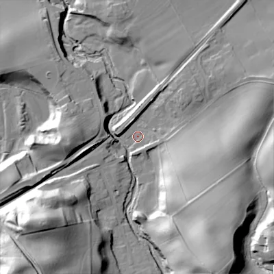 Shaded relief map of the ground around NE437NJ, computed from Environment Agency LiDAR. The ground here sits at about 22 m above sea level and falls 43 m across the surrounding 800 m. Surface water reaching this point runs off ground lying to the south-east, 32.6 m higher.