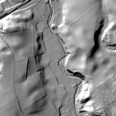 Shaded relief map of the ground around NE437QR, computed from Environment Agency LiDAR. The ground here sits at about 27 m above sea level and falls 59 m across the surrounding 800 m. Surface water reaching this point runs off ground lying to the south-east, 50.4 m higher.