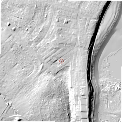 Shaded relief map of the ground around NE646XR, computed from Environment Agency LiDAR. The ground here sits at about 12 m above sea level and falls 19 m across the surrounding 800 m. Surface water reaching this point runs off ground lying to the north-east, 2.1 m higher.