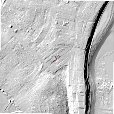 Shaded relief map of the ground around NE646XT, computed from Environment Agency LiDAR. The ground here sits at about 13 m above sea level and falls 19 m across the surrounding 800 m. Surface water reaching this point runs off ground lying to the north-north-east, 2.8 m higher.