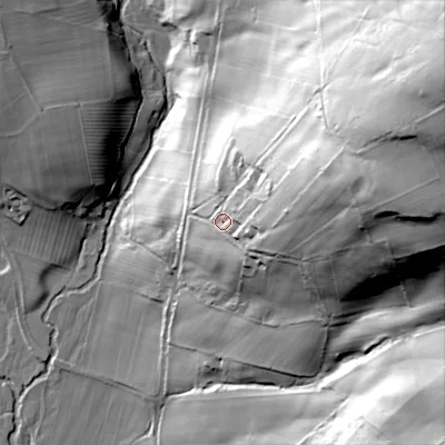 Shaded relief map of the ground around NE657JE, computed from Environment Agency LiDAR. The ground here sits at about 121 m above sea level and falls 106 m across the surrounding 800 m. Surface water reaching this point runs off ground lying to the east-north-east, 38.7 m higher.