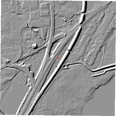 Shaded relief map of the ground around NG102FW, computed from Environment Agency LiDAR. The ground here sits at about 29 m above sea level and falls 9 m across the surrounding 800 m. Surface water reaching this point runs off ground lying to the east-north-east, 6.3 m higher.