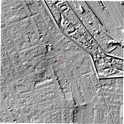Shaded relief map of the ground around NG104HP, computed from Environment Agency LiDAR. The ground here sits at about 32 m above sea level and falls 7 m across the surrounding 800 m. Surface water reaching this point runs off ground lying to the west, 4.6 m higher.
