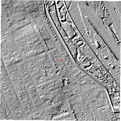 Shaded relief map of the ground around NG104HZ, computed from Environment Agency LiDAR. The ground here sits at about 33 m above sea level and falls 7 m across the surrounding 800 m. Surface water reaching this point runs off ground lying to the west, 3.4 m higher.