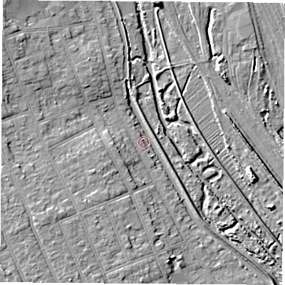 Shaded relief map of the ground around NG104JD, computed from Environment Agency LiDAR. The ground here sits at about 33 m above sea level and falls 9 m across the surrounding 800 m. Surface water reaching this point runs off ground lying to the north-west, 6.4 m higher.