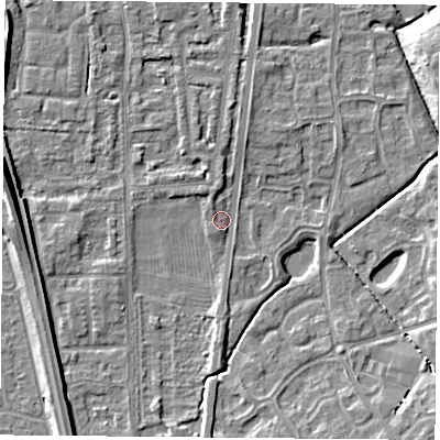 Shaded relief map of the ground around NG117FX, computed from Environment Agency LiDAR. The ground here sits at about 24 m above sea level and falls 11 m across the surrounding 800 m. Surface water reaching this point runs off ground lying to the west, 5.5 m higher.