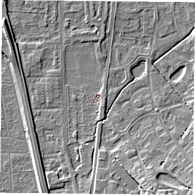 Shaded relief map of the ground around NG117HP, computed from Environment Agency LiDAR. The ground here sits at about 24 m above sea level and falls 13 m across the surrounding 800 m. Surface water reaching this point runs off ground lying to the south, 4.4 m higher.