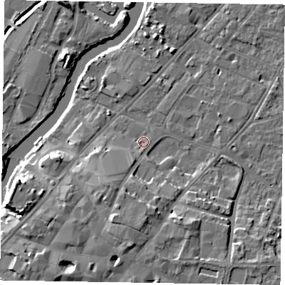 Shaded relief map of the ground around NG241EW, computed from Environment Agency LiDAR. The ground here sits at about 12 m above sea level and falls 12 m across the surrounding 800 m. Surface water reaching this point runs off ground lying to the south, 6.6 m higher.