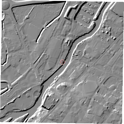 Shaded relief map of the ground around NG241FN, computed from Environment Agency LiDAR. The ground here sits at about 11 m above sea level and falls 12 m across the surrounding 800 m. Surface water reaching this point runs off ground lying to the south-west, 5.1 m higher.