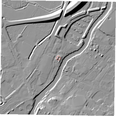 Shaded relief map of the ground around NG241FZ, computed from Environment Agency LiDAR. The ground here sits at about 13 m above sea level and falls 14 m across the surrounding 800 m. Surface water reaching this point runs off ground lying to the south-west, 2.6 m higher.