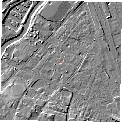 Shaded relief map of the ground around NG241JE, computed from Environment Agency LiDAR. The ground here sits at about 12 m above sea level and falls 12 m across the surrounding 800 m. The ground contributing surface water to this point lies to the east-south-east.
