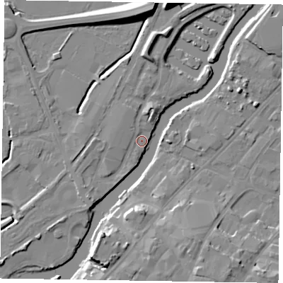 Shaded relief map of the ground around NG241WT, computed from Environment Agency LiDAR. The ground here sits at about 11 m above sea level and falls 12 m across the surrounding 800 m. Surface water reaching this point runs off ground lying to the south-west, 5.1 m higher.