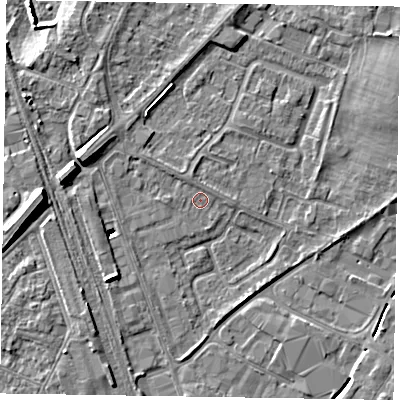 Shaded relief map of the ground around NG242EX, computed from Environment Agency LiDAR. The ground here sits at about 12 m above sea level and falls 11 m across the surrounding 800 m. Surface water reaching this point runs off ground lying to the north-north-west, 0.8 m higher.