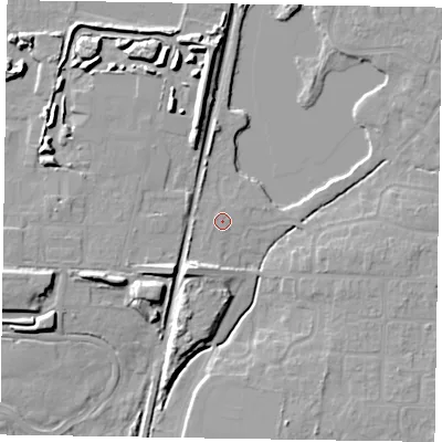 Shaded relief map of the ground around NG243DT, computed from Environment Agency LiDAR. The ground here sits at about 16 m above sea level and falls 10 m across the surrounding 800 m. Surface water reaching this point runs off ground lying to the west-north-west, 0.5 m higher.