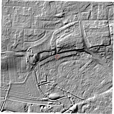 Shaded relief map of the ground around NG243HJ, computed from Environment Agency LiDAR. The ground here sits at about 14 m above sea level and falls 9 m across the surrounding 800 m. Surface water reaching this point runs off ground lying to the north-north-east, 4.5 m higher.